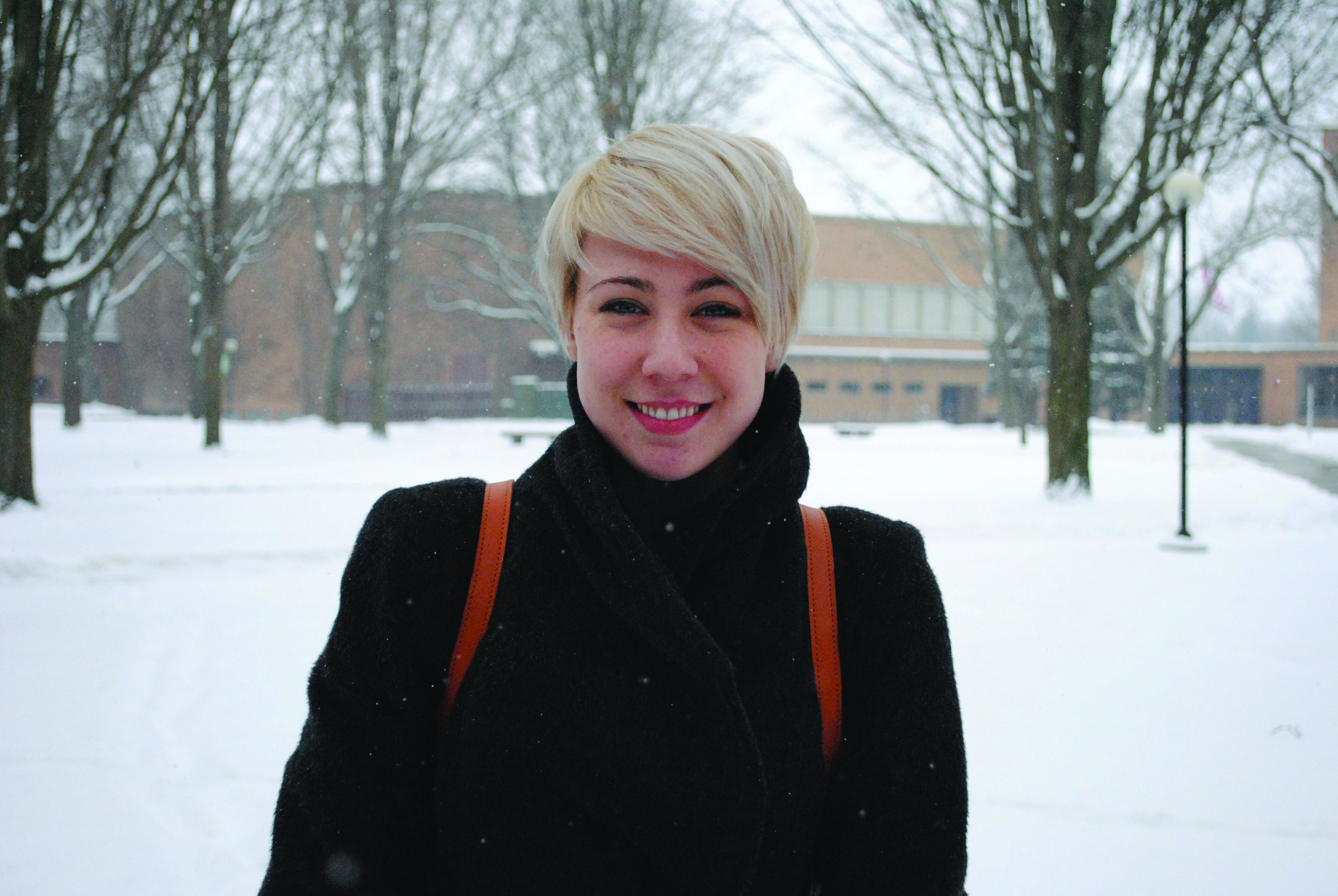 Portrait of Devon Barnes Spitler on a snowy campus