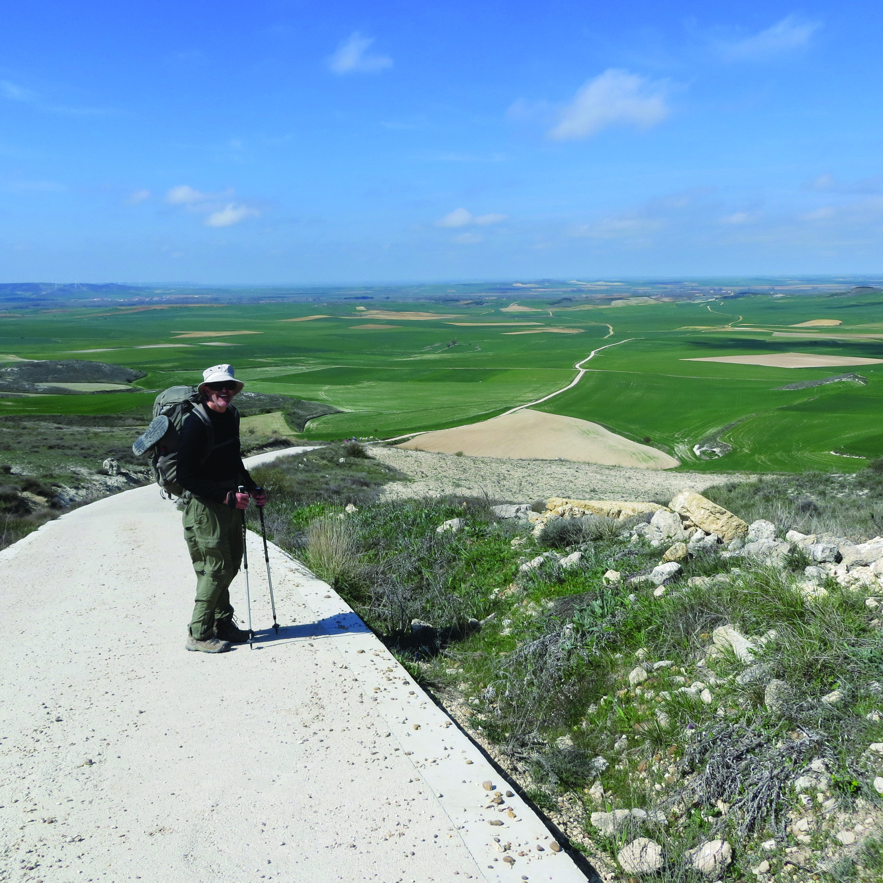 Dean Rhodes walks on a scenic pathway in Spain