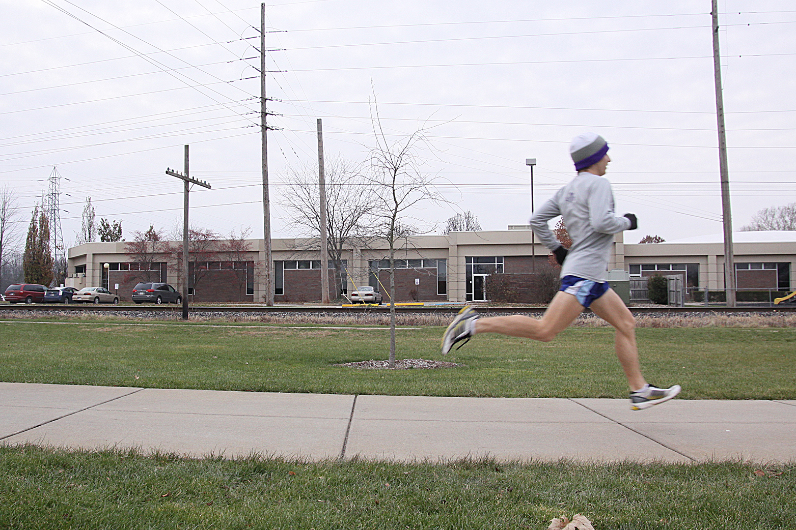 Ryan Smith runs down a path on the Goshen College campus