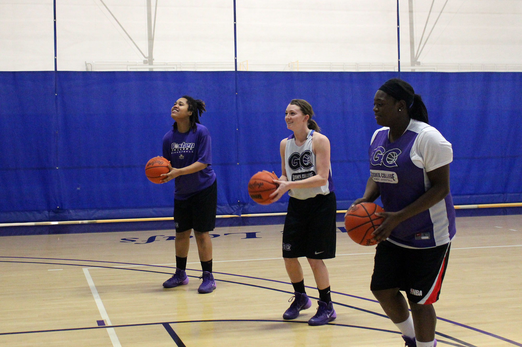 basketball players practice shooting