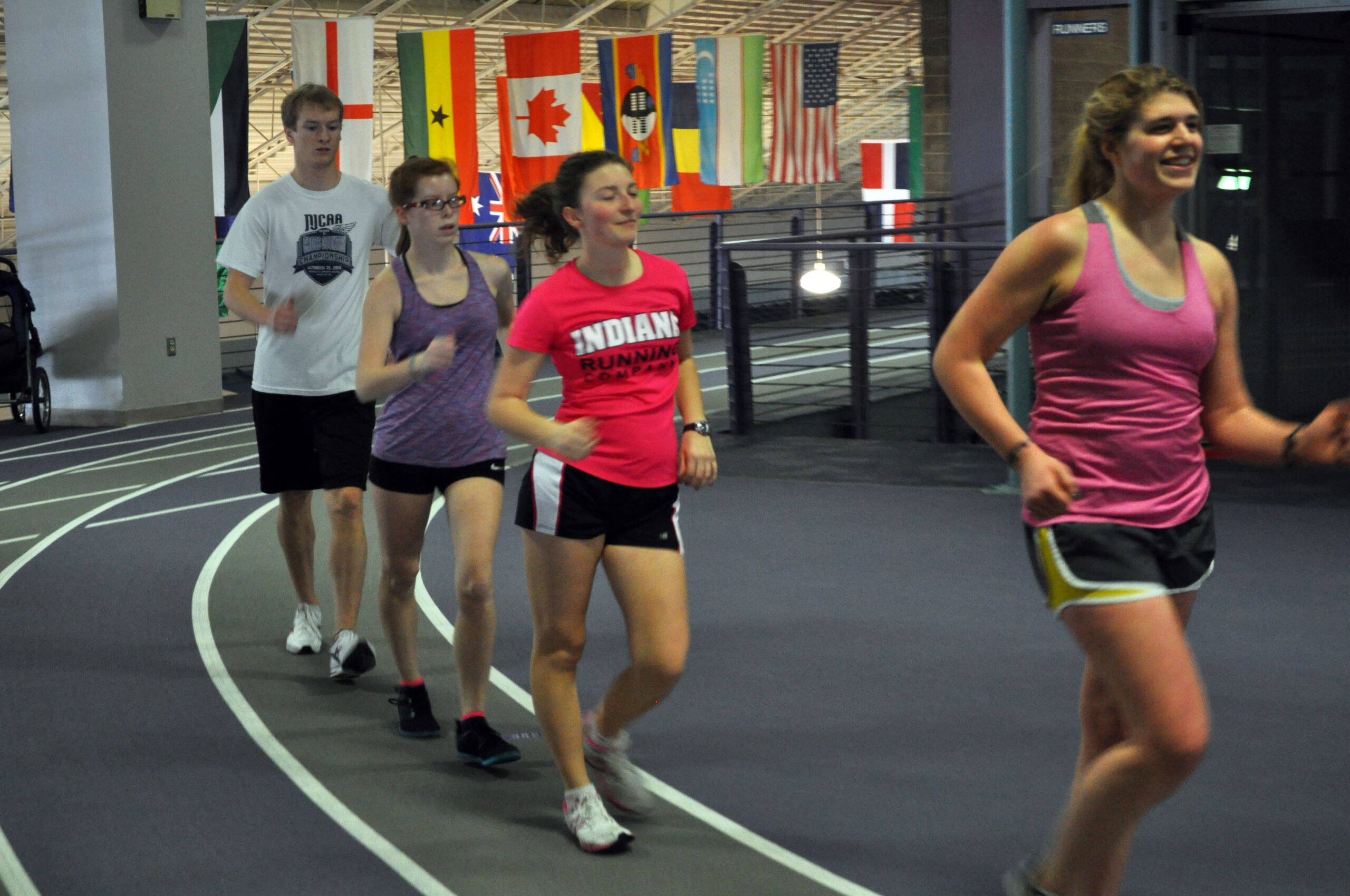 race walkers on indoor track