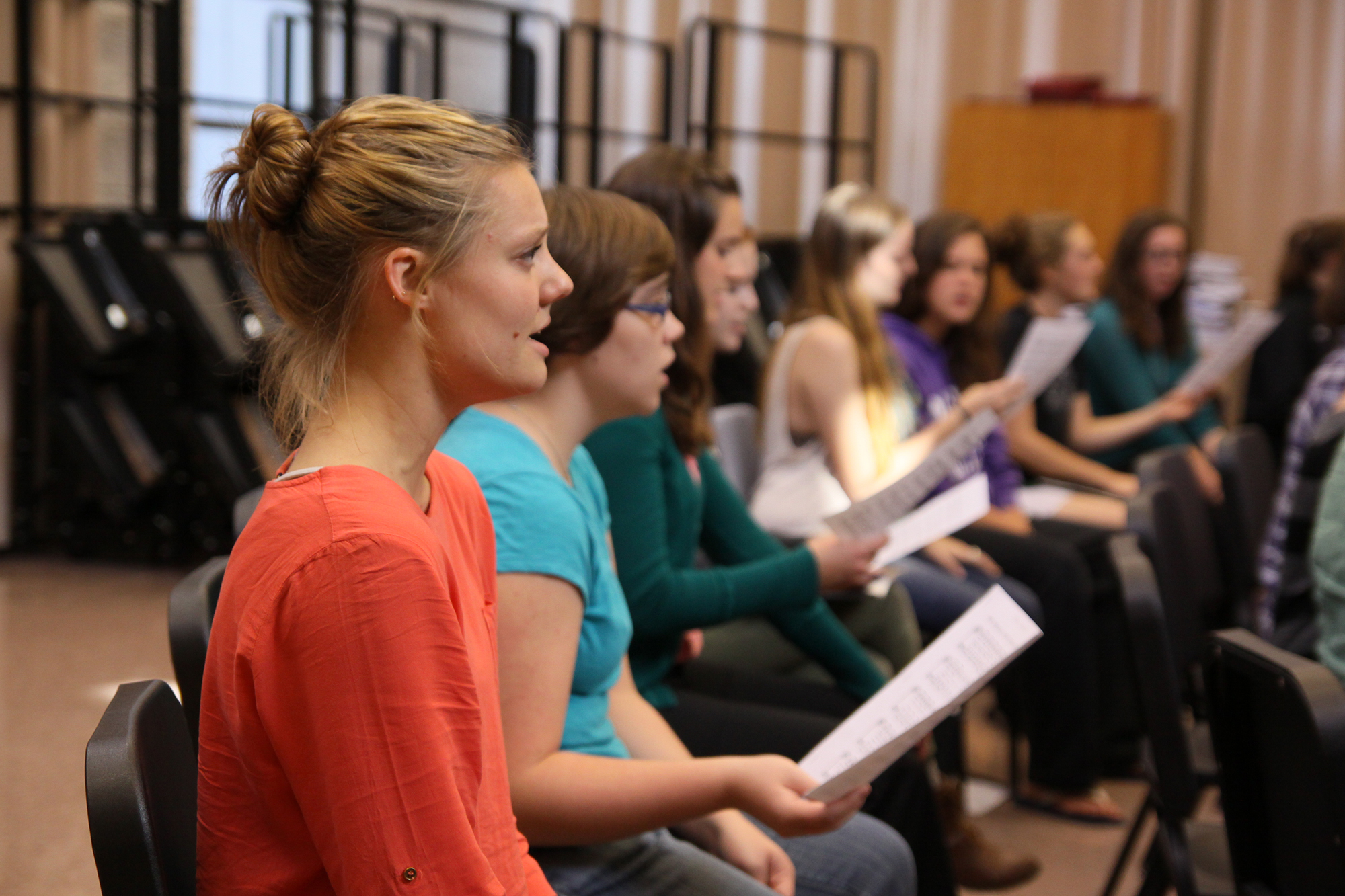 People sing during choir practice
