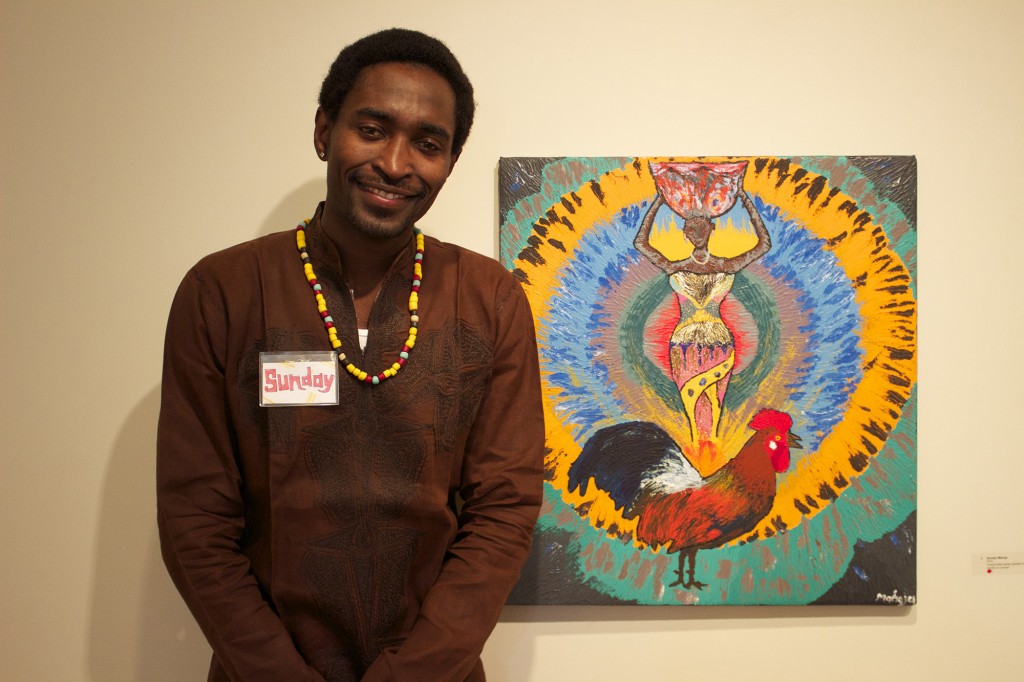 Sunday Mahaja poses with his piece entitled "Oya." 
