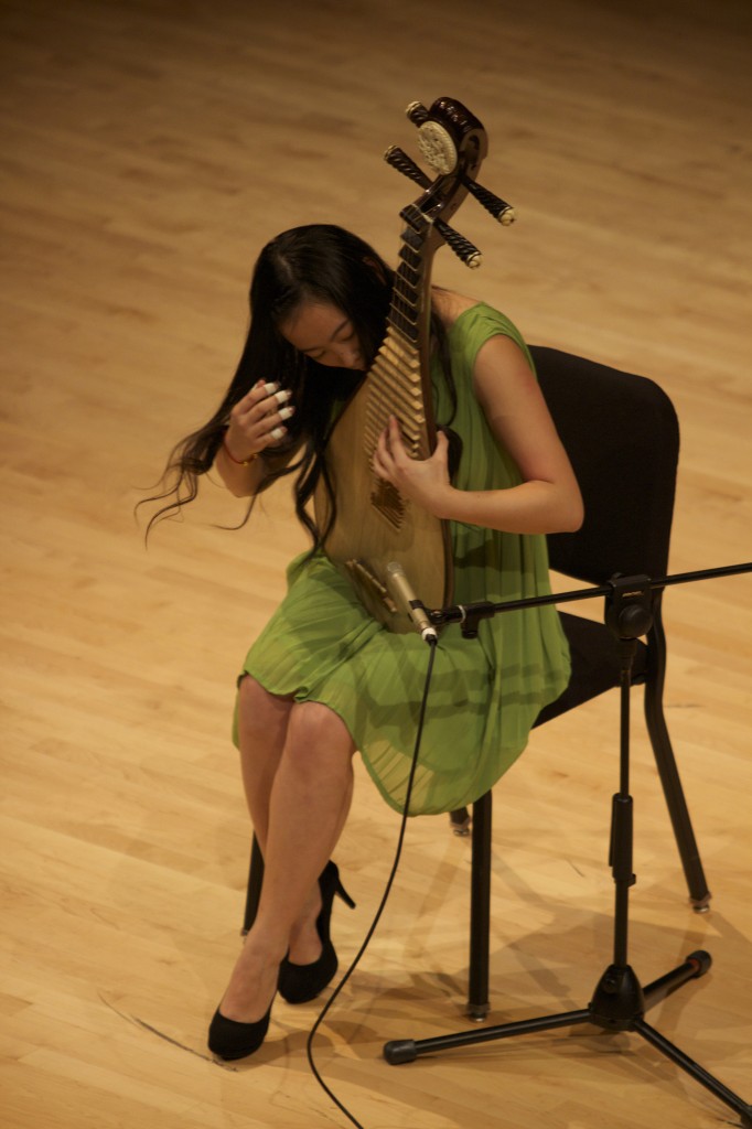 Tiantian Chen plays a traditional Chinese instrument.