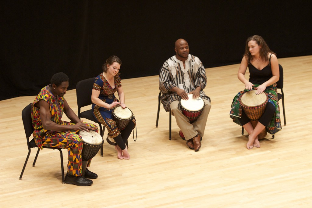 Sunday Mahaja, Maddie Ruth, Adama Millogo and Melanie Drinkwater perform African drumming.