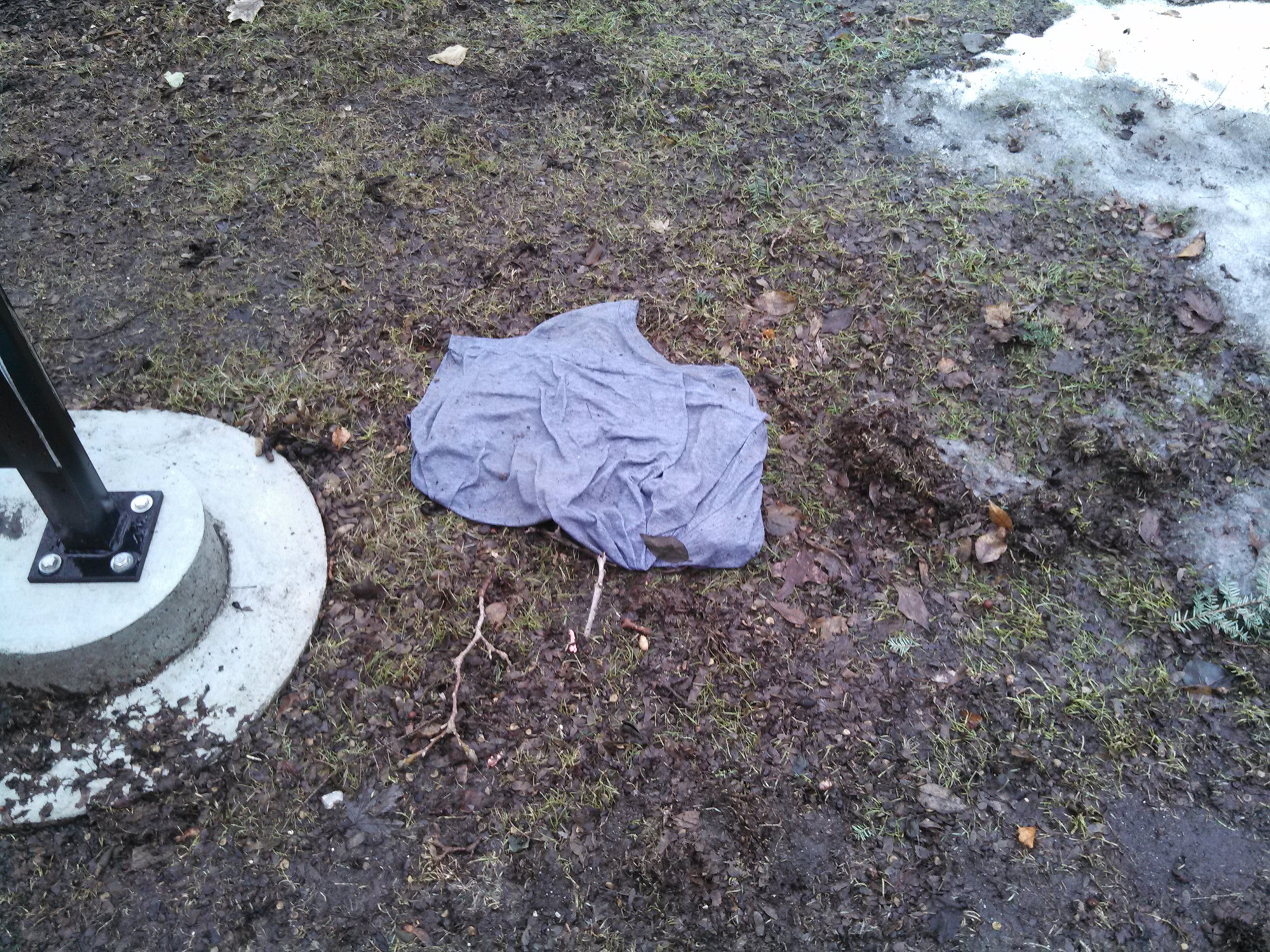 A waterlogged T-shirt found under the melting snow on campus