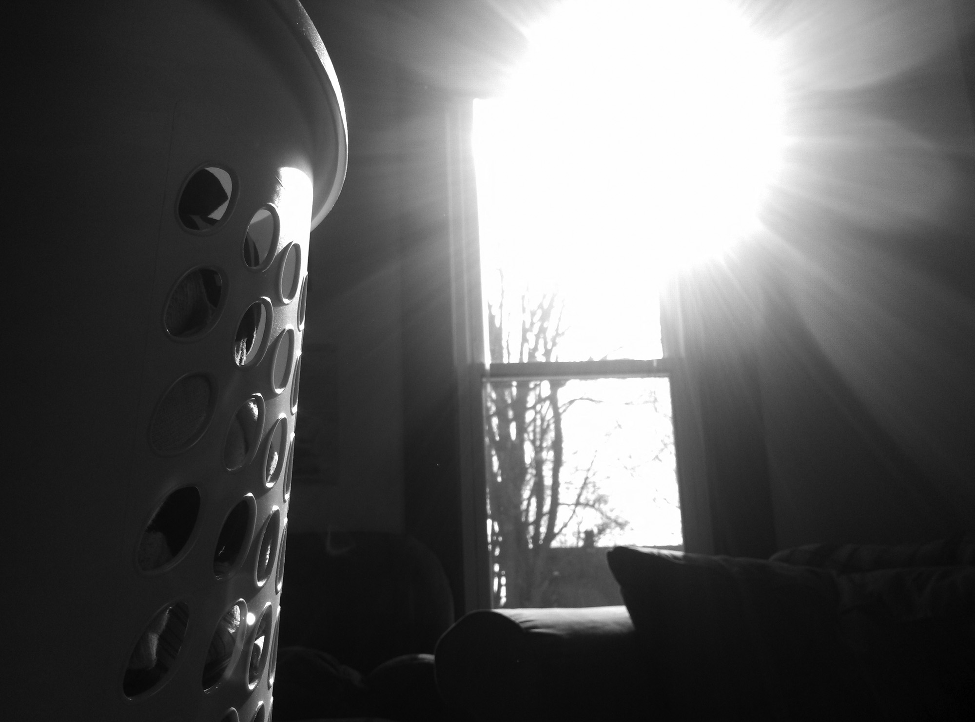Foreboding image of the silhouette of a laundry basket
