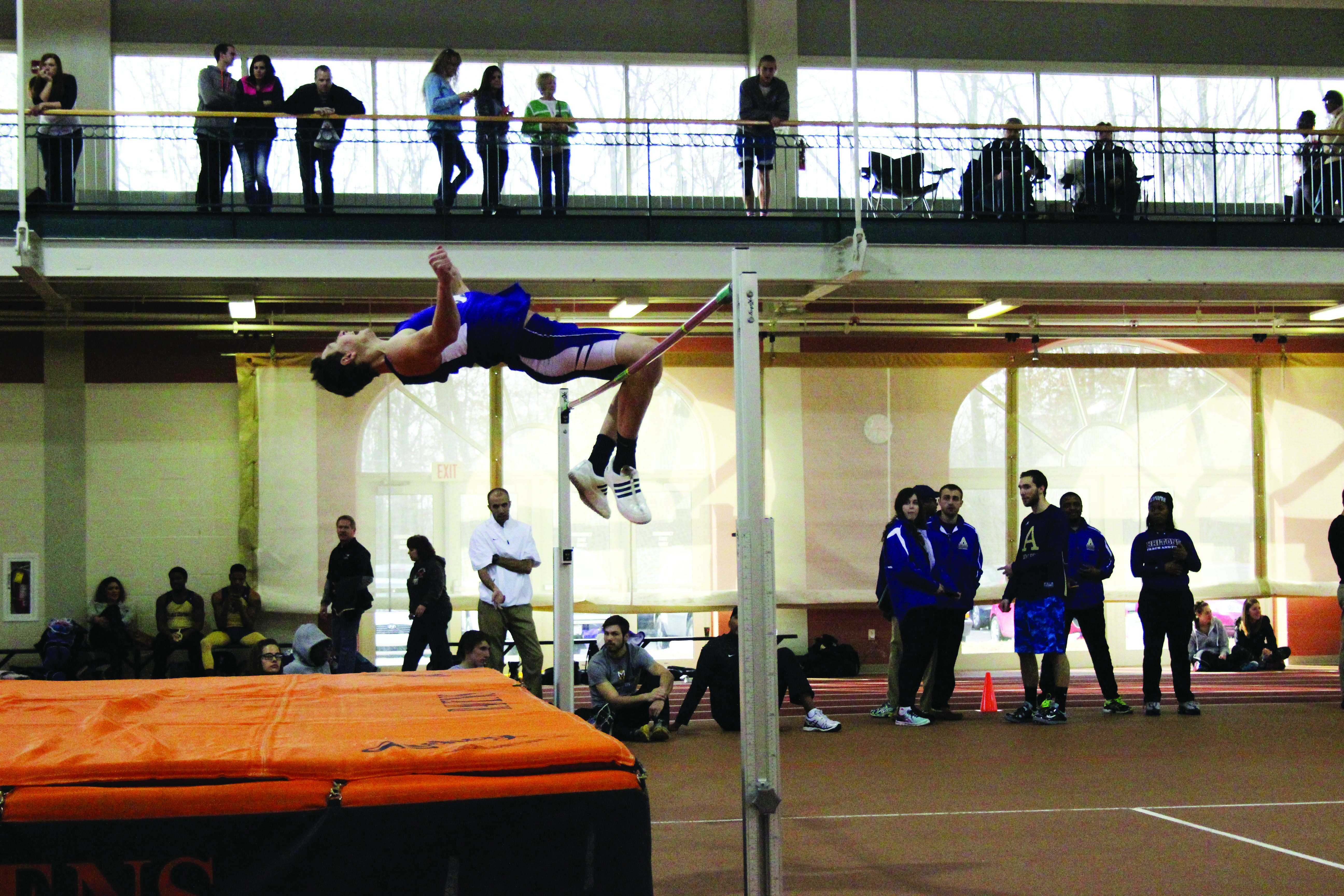 Image of Derek Swartzendruber mid-jump over the bar during the high jump event