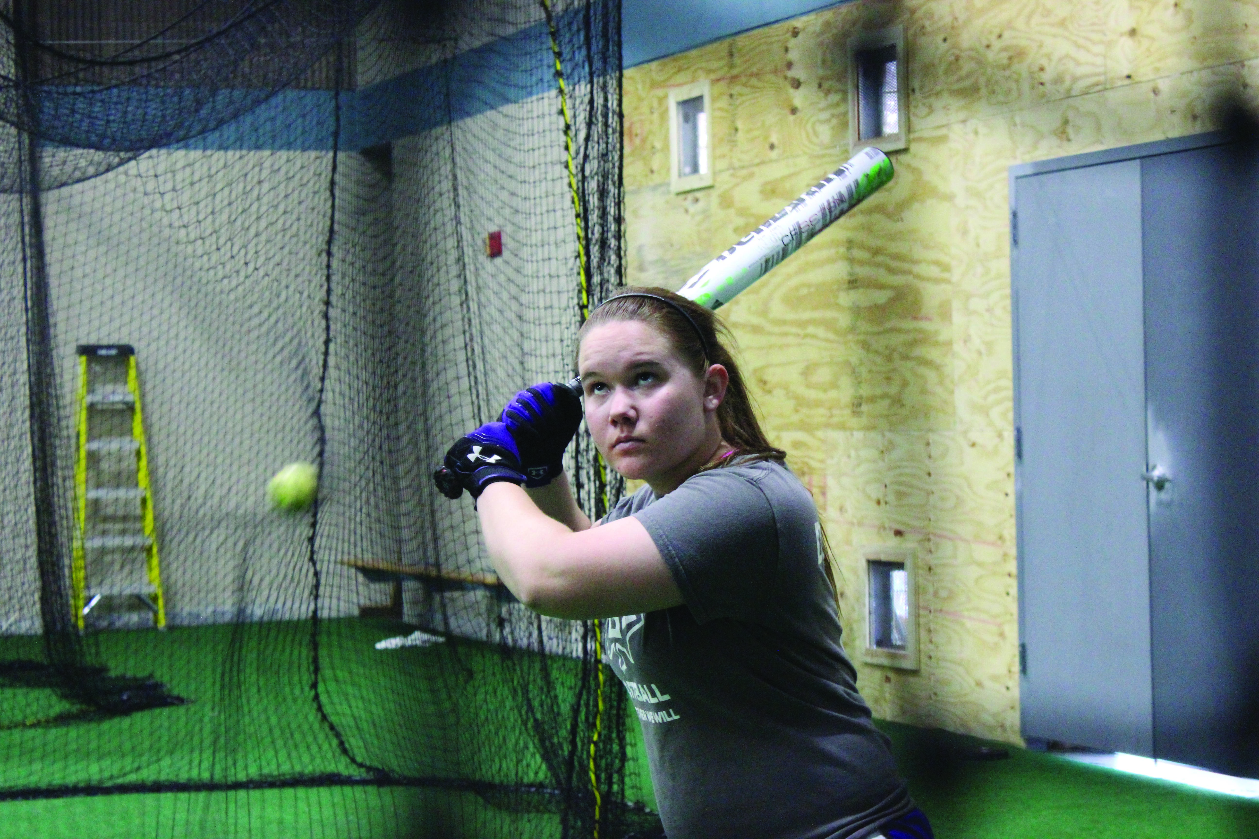 Mackenzie Davenport practices hitting in the RFC turf room