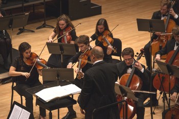 Abbie Kaser (left) performs with the Goshen College Symphony Orchestra on Friday evening. Photo by Hannah Sauder.
