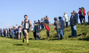 Luke Graber, a junior, finishes his Crossroads League Championship run. Photo by Marissa Hochstetler.