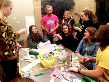 Students create construction paper stockings for their friends at the second event of the "12 Days of Christmas." Photo by Emma Koop Liechty.