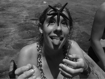 New funnies editor Anneliese Baer becomes acquainted with a starfish. Photo contributed by Anneliese Baer