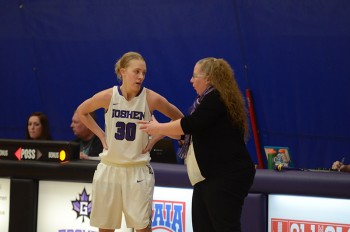 Coach Stephanie Miller talks to junior Sophia Sears during the game against Marian University. Photo by Maria Bischoff