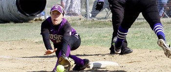 Abby Flickner, senior, stretches to record an out at first base. Photo contributed by Bill Scott/University of St. Francis