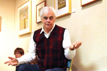 Artist Doug Unger presents during the reception of his exhibit Amish Landscapes, Charm, Ohio.
