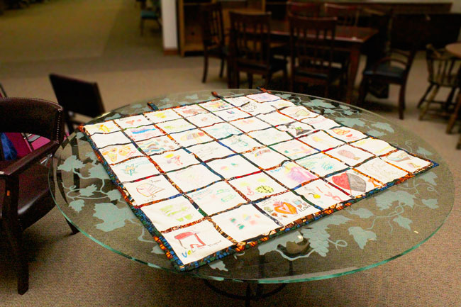 quilt spread out on table