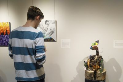 Ethan Lapp looks at art piece