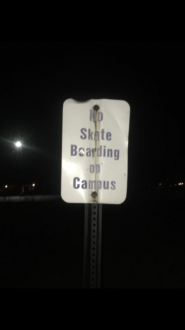 Sign reading: "No Skate Boarding On Campus"