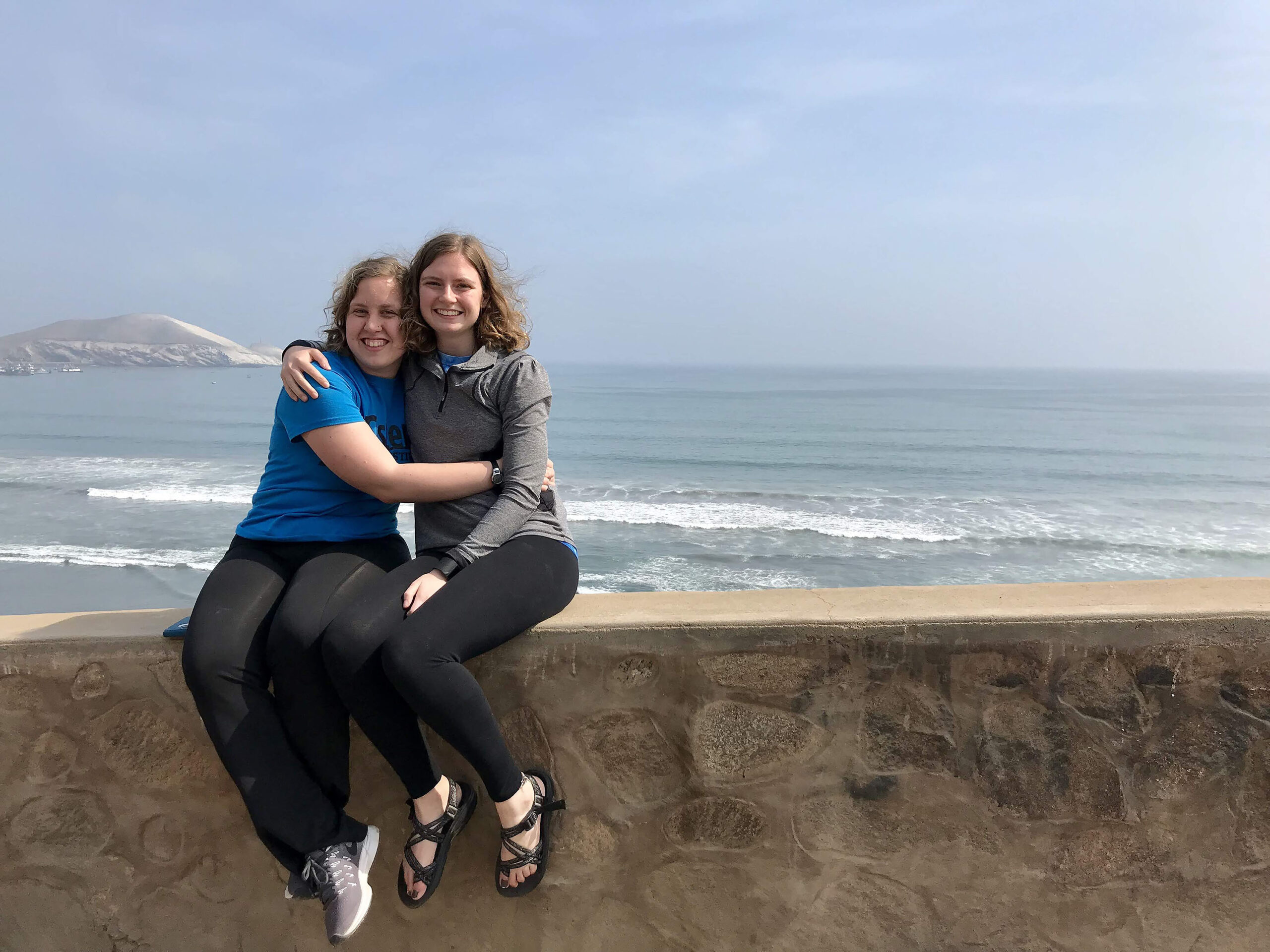 Renee and Anne Buckwalter take photo by the ocean