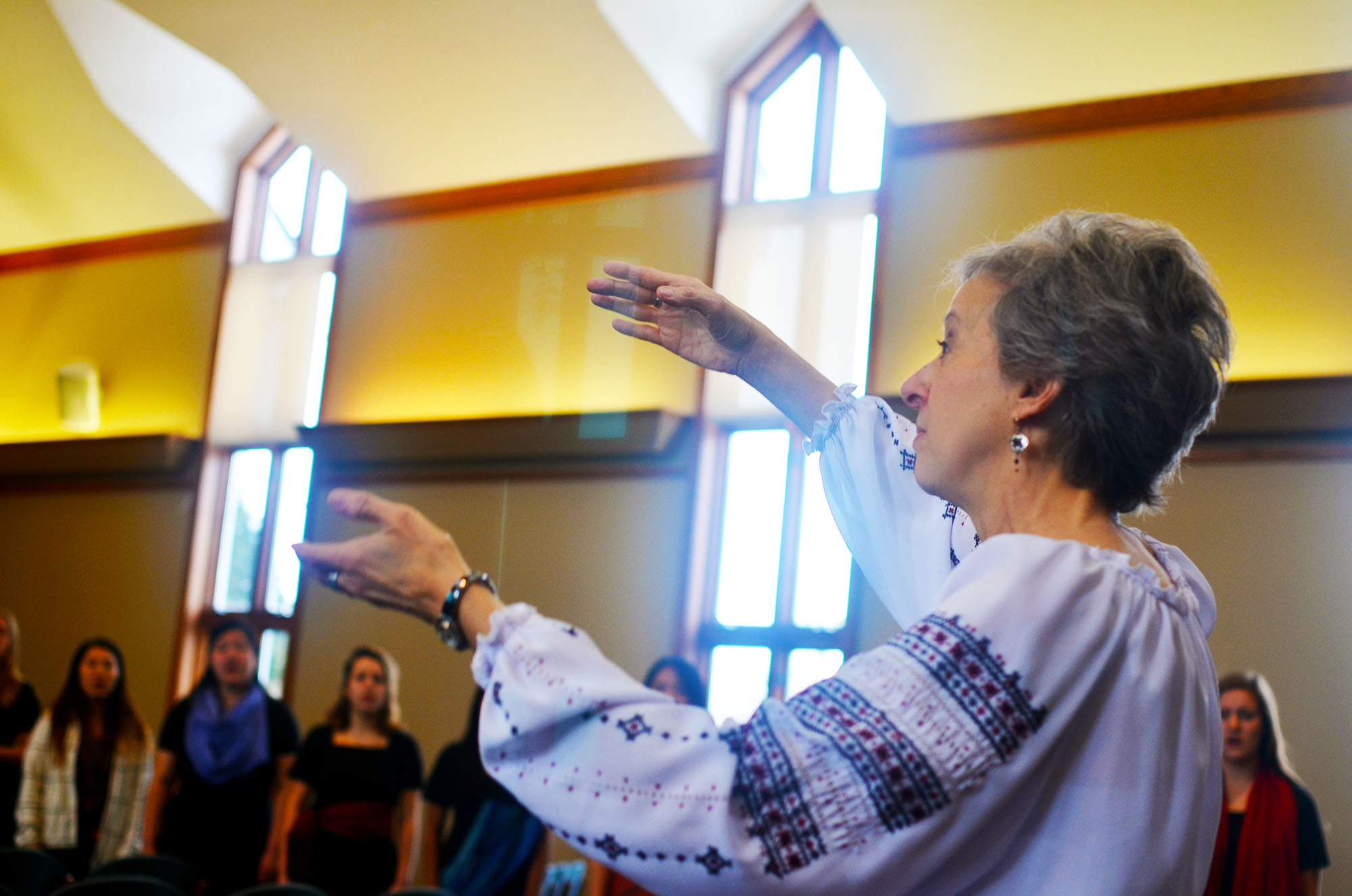 Debra Detweiler conducts in a church