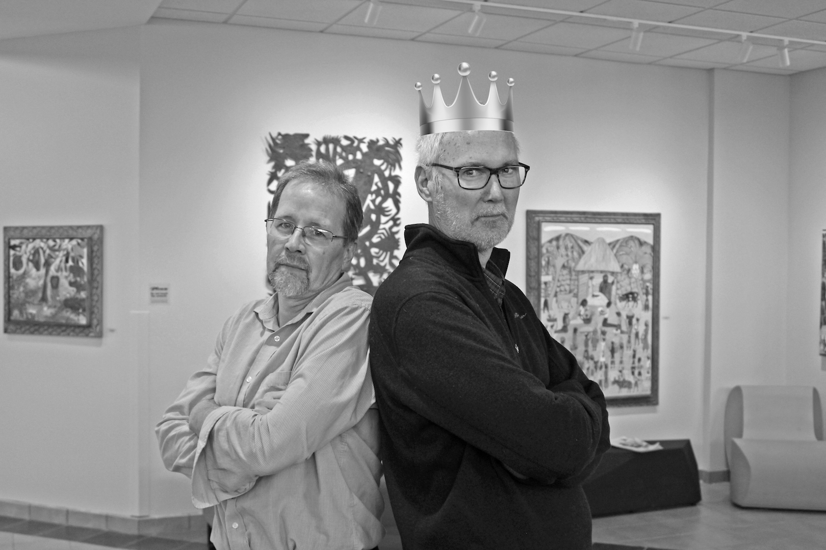 Keith Graber Miller wears a crown and poses back to back with John Roth