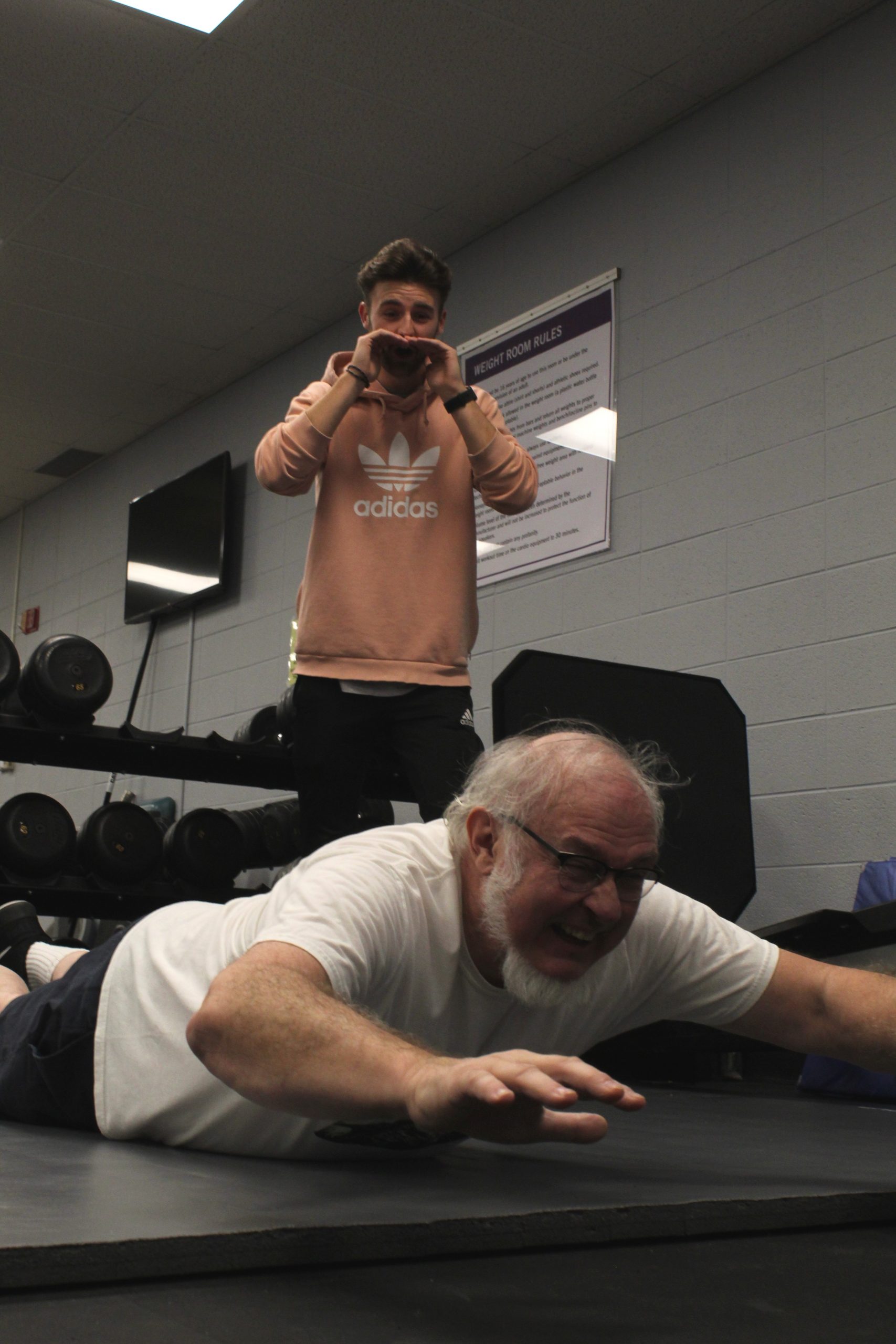 Ollie Smith trains Paul Keim in weight room