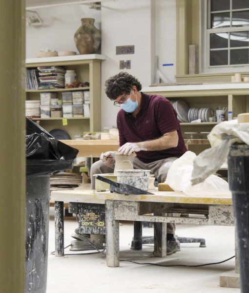 Merill Kraybill working on pottery wheel