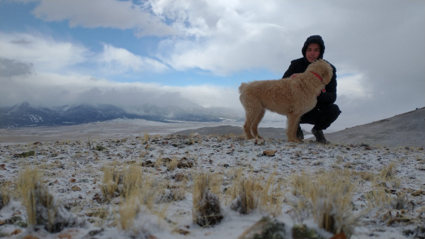 Stutzman with his dog in the desert