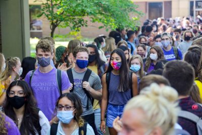 Masked students on campus