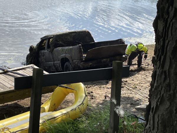 Truck that was revealed under the surface of the dam pond