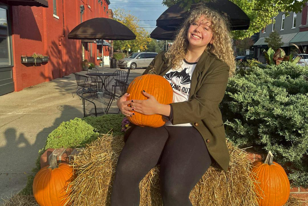 Olivia Ewry with pumpkin