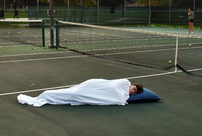 Eli sleeping on tennis court