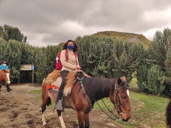 Ebithal rides a horse in Ecuador