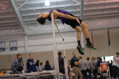 Simon Graber Miller clears the bar in the high jump.