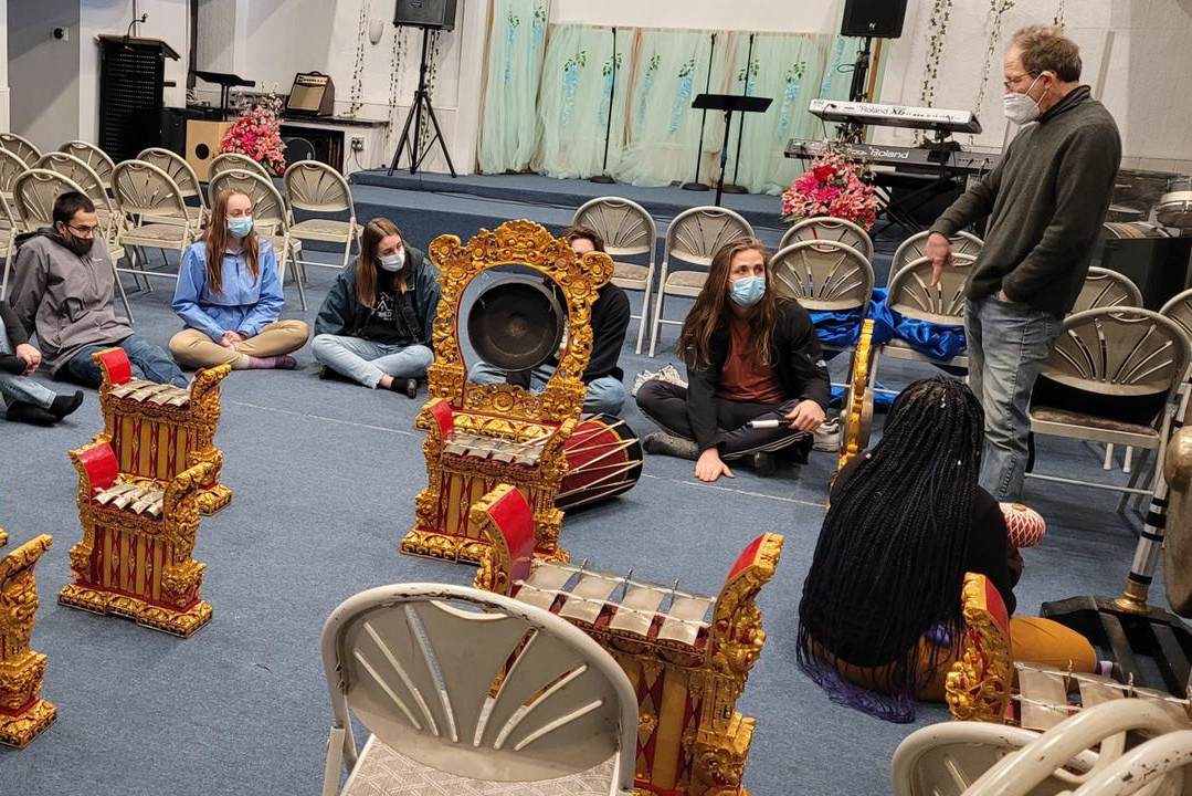 Students learn to play traditional gamelan instruments.