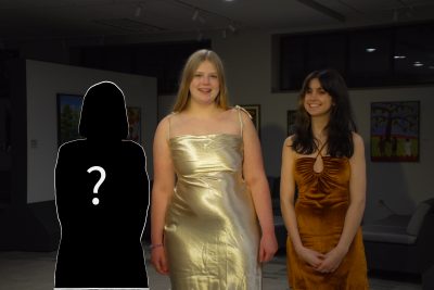 Haley Kirkton and Rachel Mast pose for a picture next to a mysterious figure representing the next bachelorette.