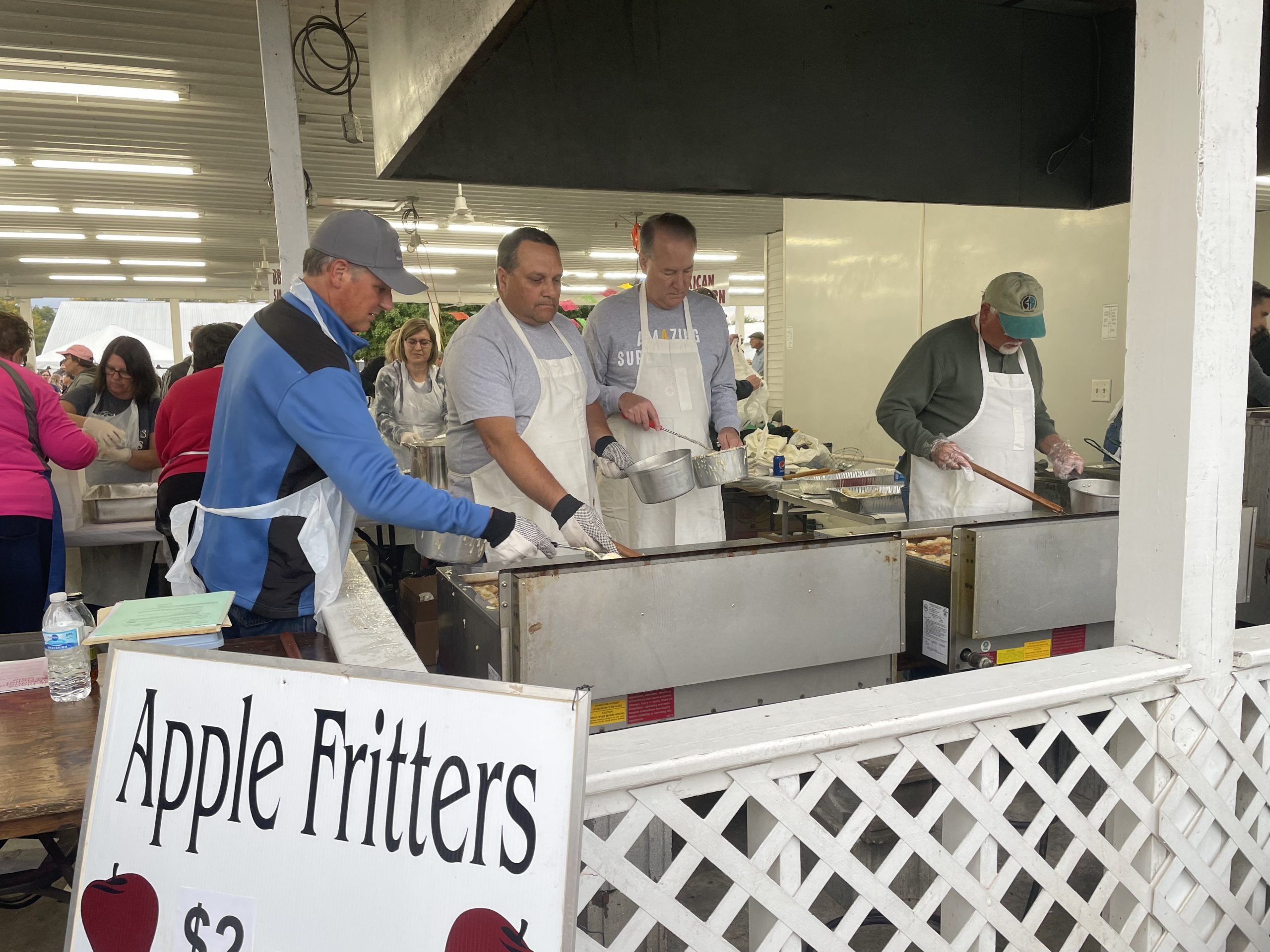 Members of Yellow Creek church stand over a deep fryer