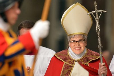 President of Goshen College, Rebecca Stoltzfus stands dressed as the Pope.